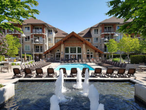 pool 2 Image of a beautiful pool and pool deck at a Kelowna rental property from Vantage West Property Management on a sunny day.