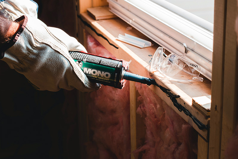 A repair person performing a window upgrade