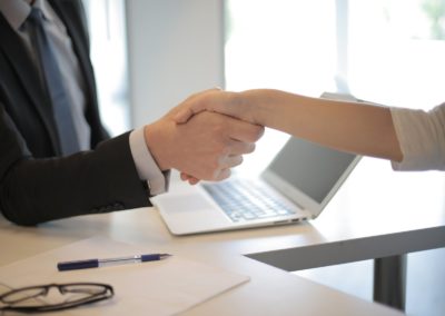 A property owner and a property manager shake hands over a desk with a laptop to agree to managing their new home. We are a business in Kelowna BC that offers services for property owners looking to make more on their rentals, with less of a hassle. Even if there's an emergency on your rental, we're here to help your rental increase in value. Good tenant screening