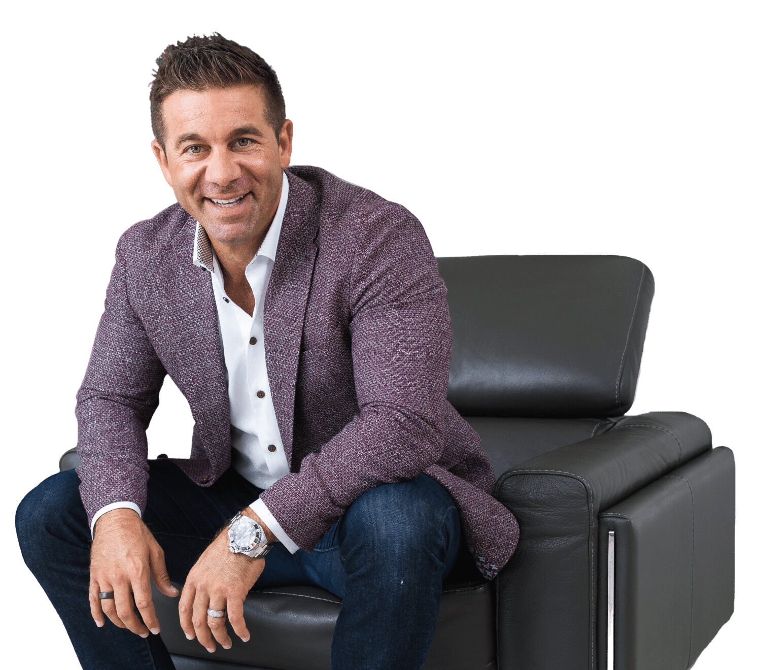 AJ Hazzi Photo A photo of AJ Hazzi in a purple blazer sitting in a leather chair.