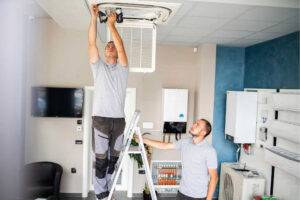 Maintenance guys working on a ceiling fan