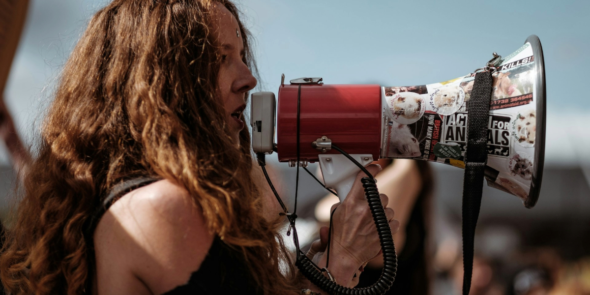A woman protesting with a megaphone